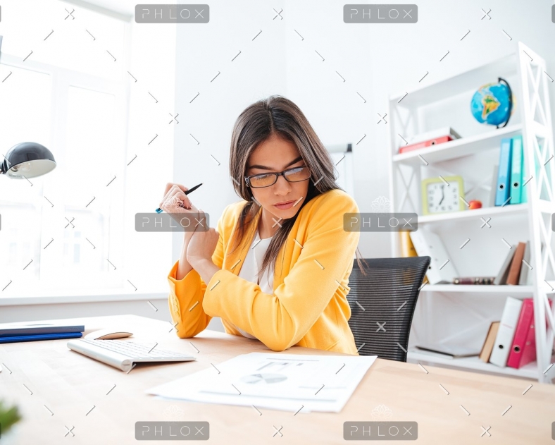 demo-attachment-449-businesswoman-analysing-document-P8WSNMC
